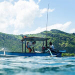 American businessmen fishing on a Guyanese river