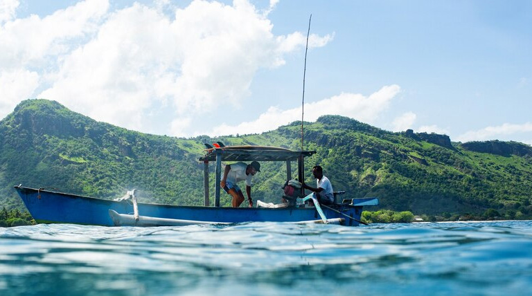 American businessmen fishing on a Guyanese river